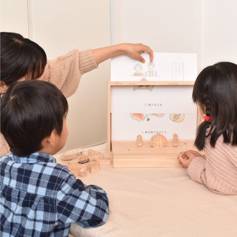 Momotaro, a small picture book theater in the forest 